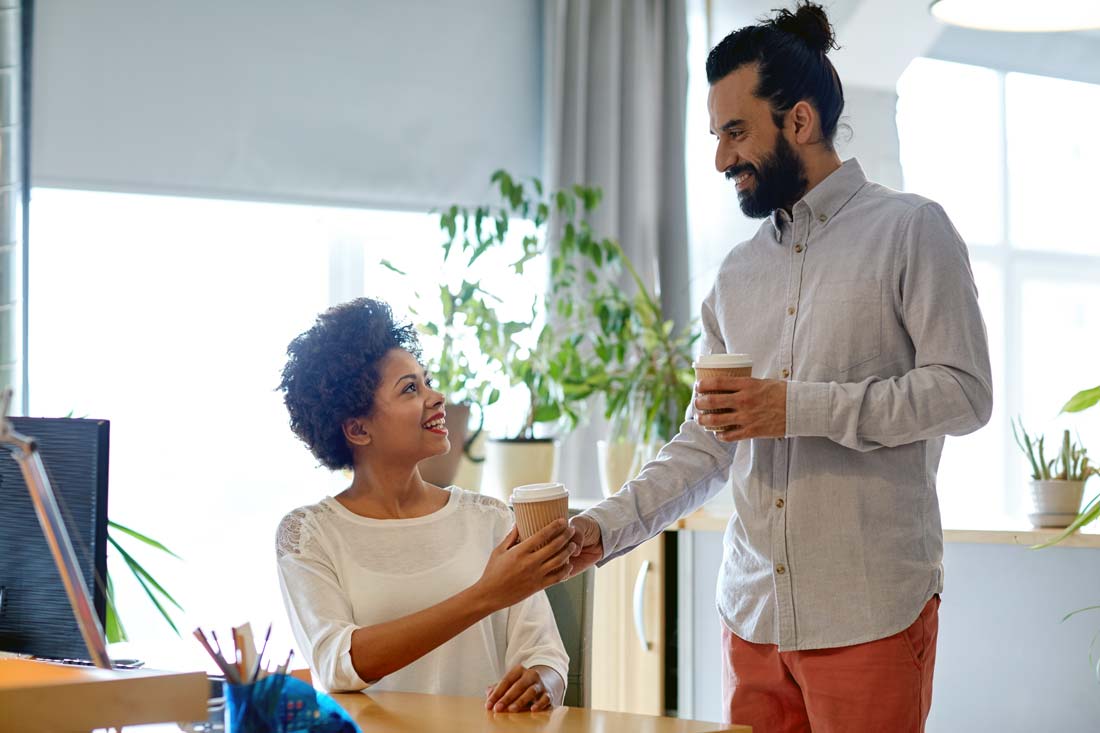 generous man brings colleague coffee as act of kindness