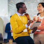 happy employees talking to each other