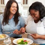 two women boosting mood with happy foods