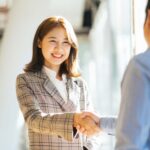 woman being introduced to another person