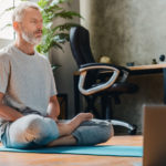 older man meditating for self-improvement