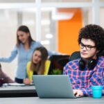 mentally checked out employee sitting alone at work