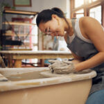 woman learning pottery to be more creative