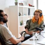 man and woman recording a podcast