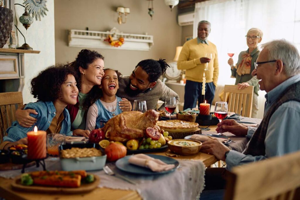 Happy family enjoying a meal together with family quotes