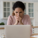 frustrated women writing impulsive decision email