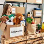 Girl donating her old toys learning about the benefits of gratitude