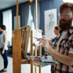 man learning to paint to boost creativity