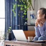 woman at home thinking about dealing with changes