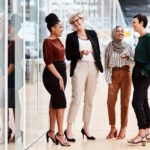 a group of women supporting each other at work