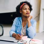 woman pondering self-improvement questions