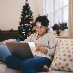 woman using computer to search for job during holidays