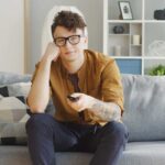 man feeling tired during free time leisure activity