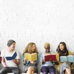 a diverse group of young people reading and telling stories