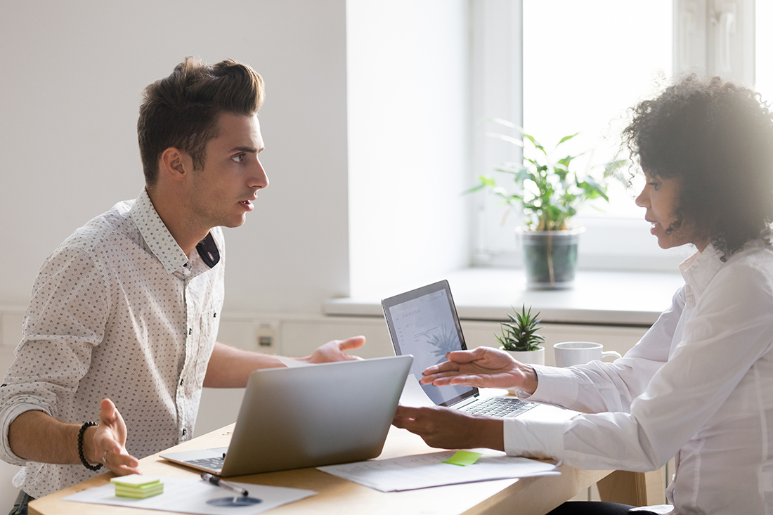 Two coworkers disagree in a workplace confrontation