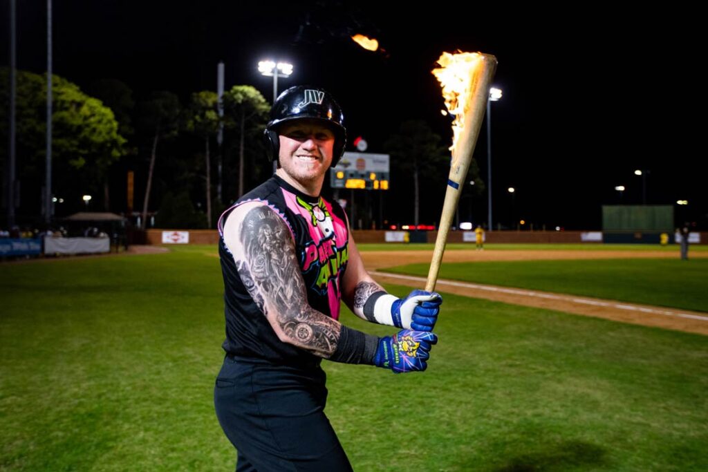 A Party Animals player holding a flaming bat
