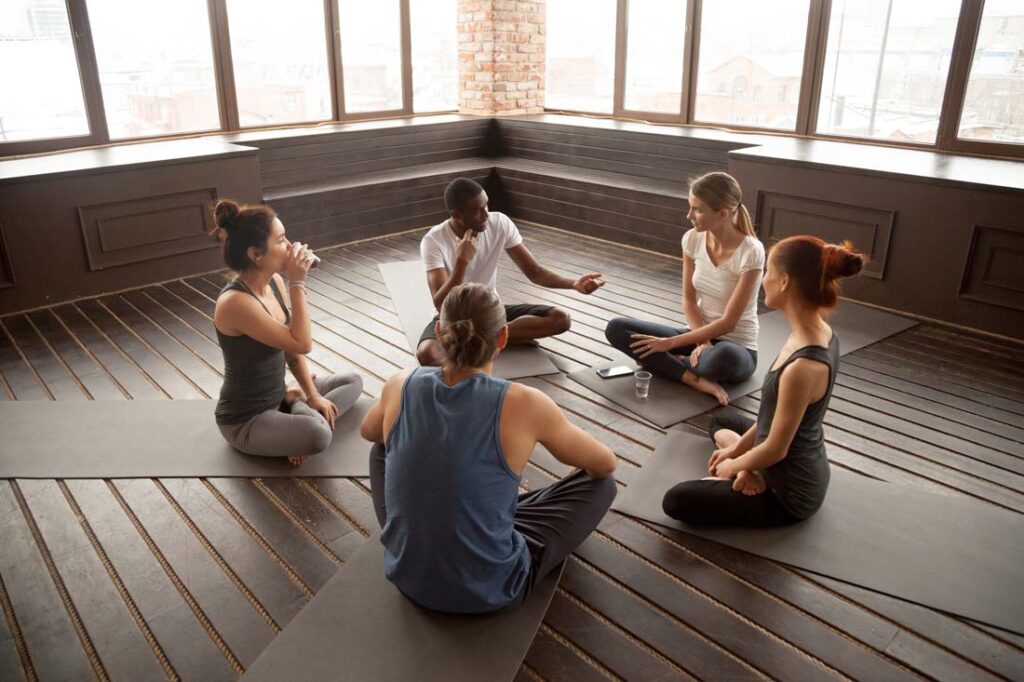 a group of people at a meditation retreat