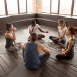 a group of people at a meditation retreat