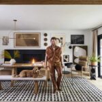 Bobby Berk standing in a well-appointed living room