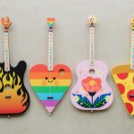 4 colorful one-string children's guitars that are part of the TinkerTar line created by Rockbridge Guitars' co-founder Brian Calhoun