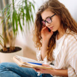 Young woman reading a book