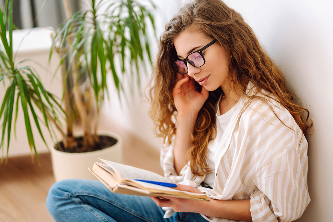 Young woman reading a book