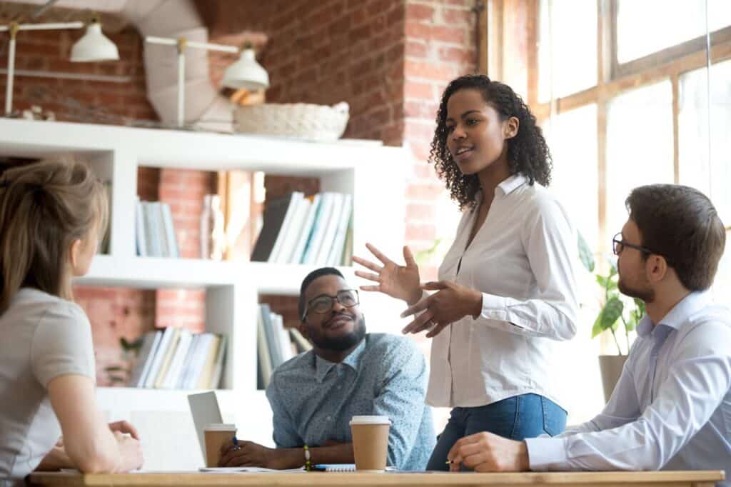 diverse group of staff discuss examples of soft skills