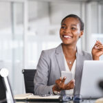 Young Black business woman learning how to improve time management skills at work