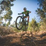 Mature man riding a mountain bike learning to face his fears