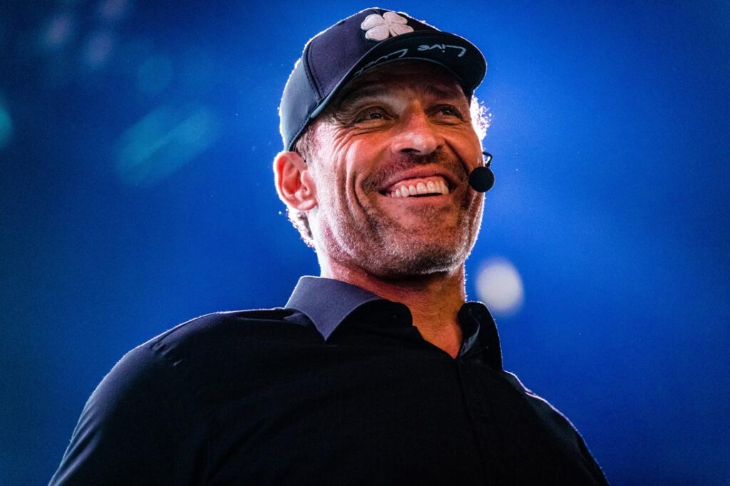 close-up image of Tony Robbins speaking at an event