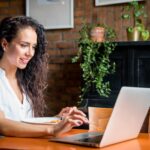 Woman using a ChatGPT alternative on her laptop