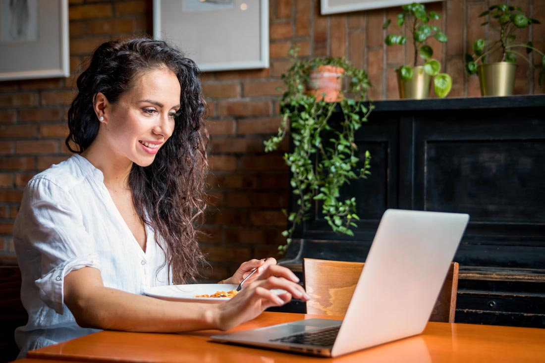 Woman using a ChatGPT alternative on her laptop