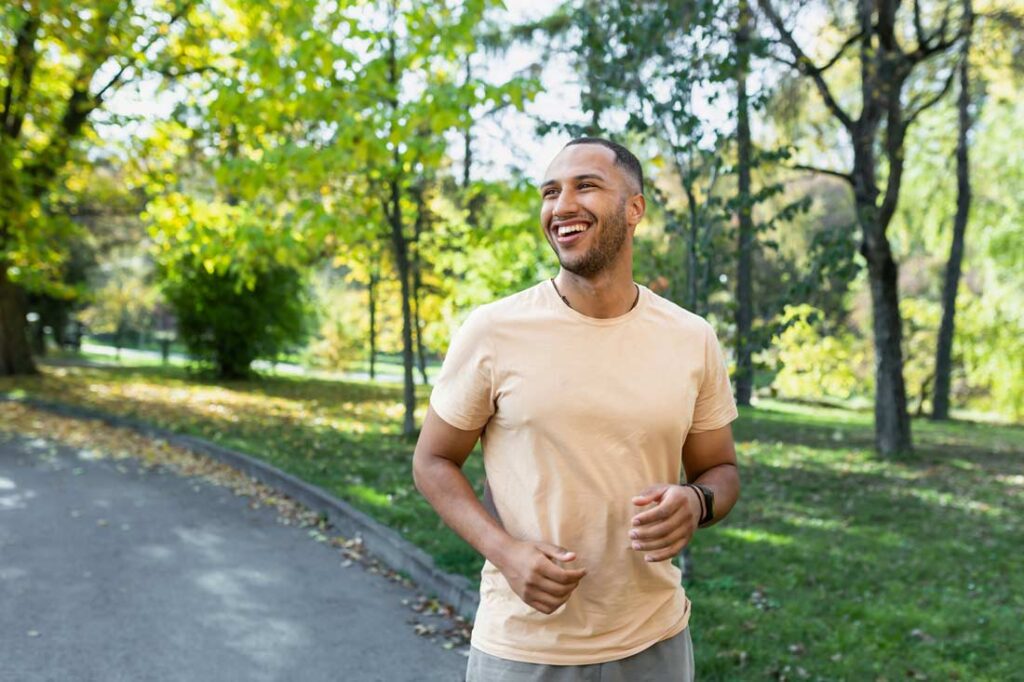 Young man jogging outside to show you can accomplish the goals you set for yourself