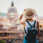 Woman in a hat with backpack traveling