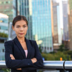 Fearless woman in front of city skyline