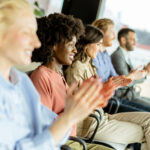 group of employees clapping