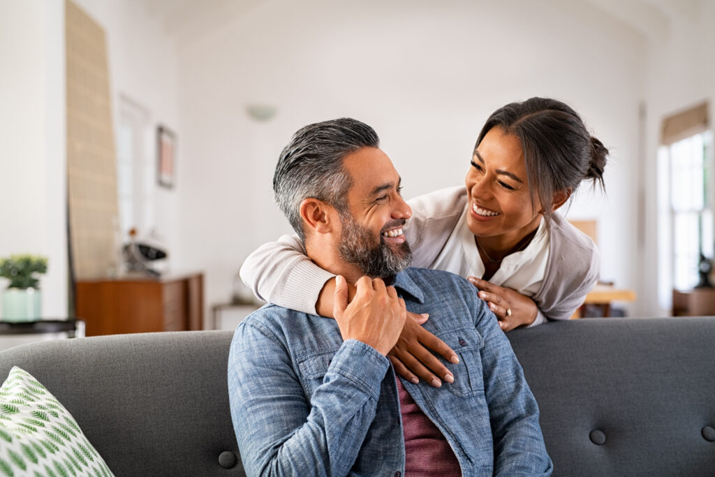 Man and woman embracing one another.