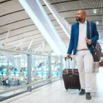 professional man at an airport working abroad