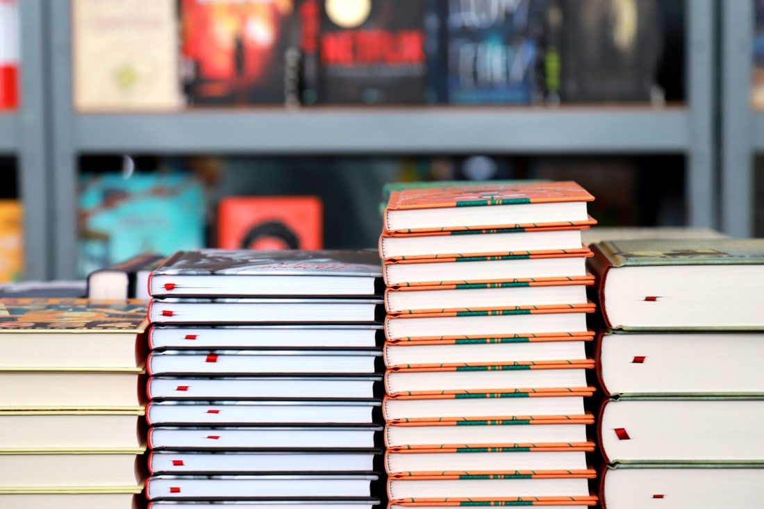 Stacks of book copies on a table