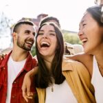 a group of people smiling and laughing together