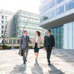 Multiracial group of business people walking outdoors