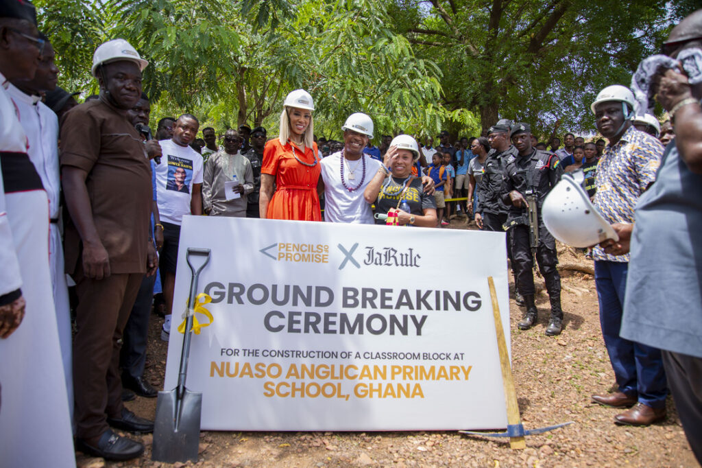 Pencils of Promise CEO Kailee Scales, rapper Ja Rule, and local community members in Ghana at an opening ceremony for a newly built school in the country