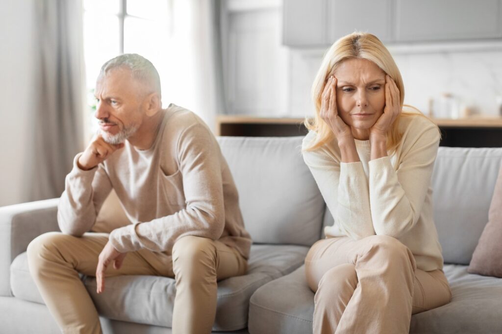 a man and a woman looking unhappy