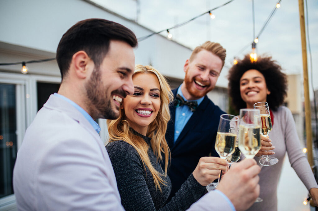 People celebrating over a glass of champagne