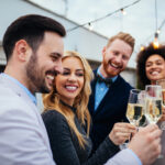 People celebrating over a glass of champagne