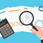 A graphic of a magnifying glass and a calculator on top of a pile of charts and data.