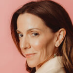 headshot of Carolina García Jayaram with pink backdrop