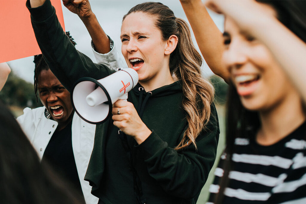 woman shouting into a megaphone