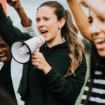 woman shouting into a megaphone