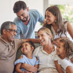 multigenerational family happy on sofa